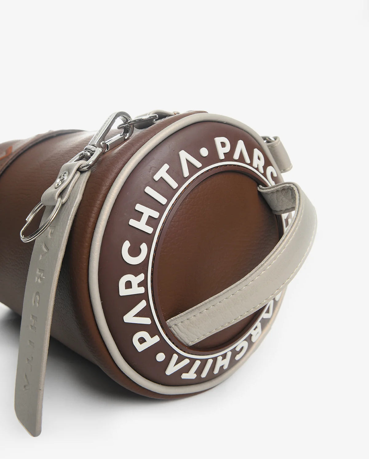 Brown leather pouch with 'Parchita' branding on a white background
