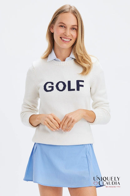 Woman wearing a white sweater with 'GOLF' text and a light blue skirt on a white background.