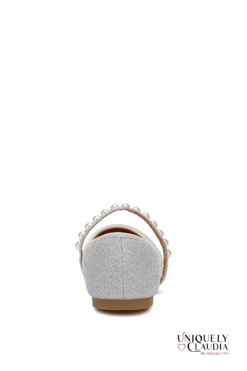 Silver glittery sandal with pearl embellishments on a white background