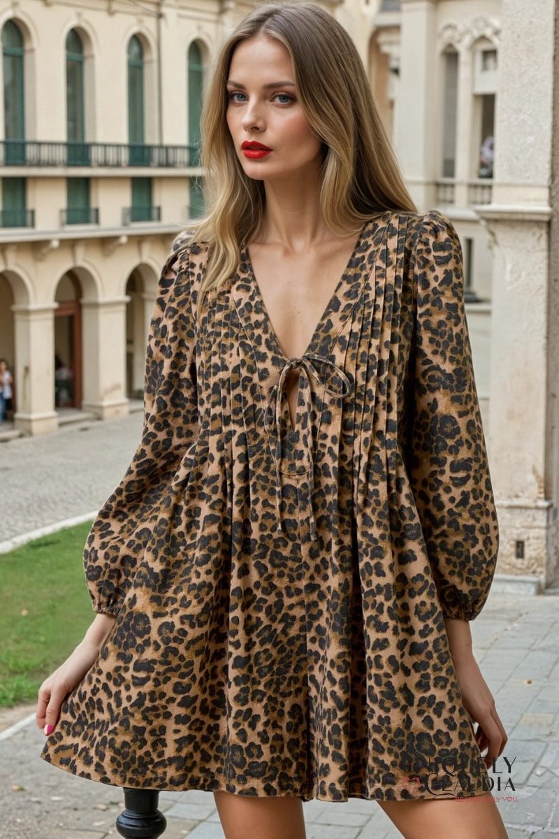Woman wearing a leopard print romper in an outdoor setting