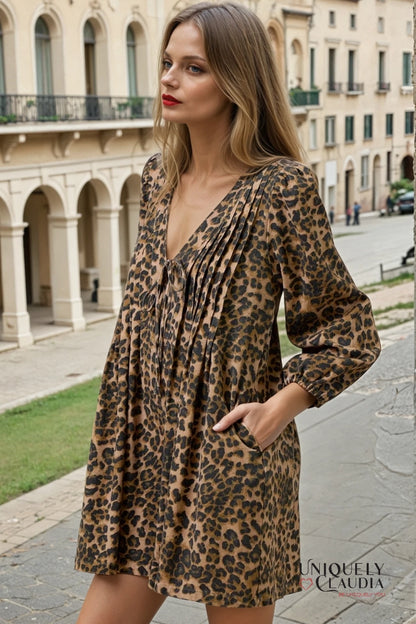 Woman wearing a leopard print romper in an urban setting