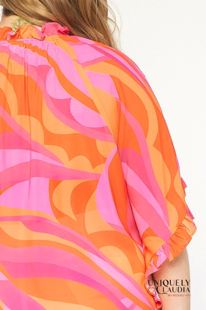 Plus size woman wearing pink tunic