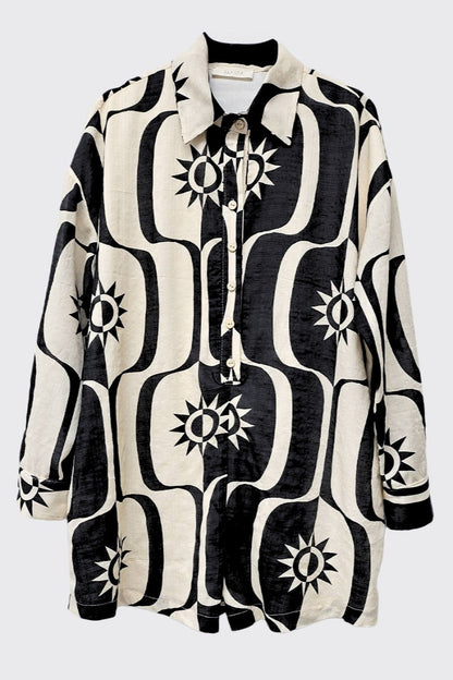 Black and white patterned shirt with star design on a white background