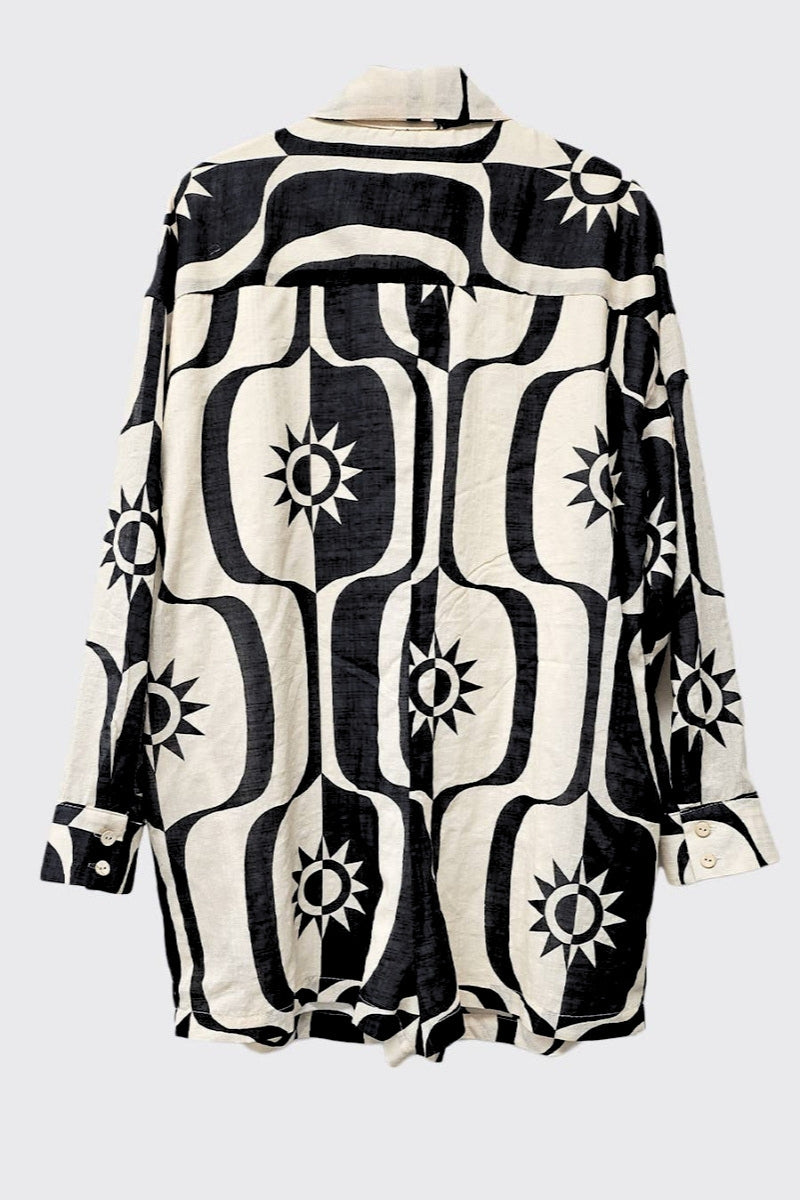 Black and white patterned shirt on a light gray background