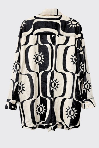 Black and white patterned shirt on a light gray background