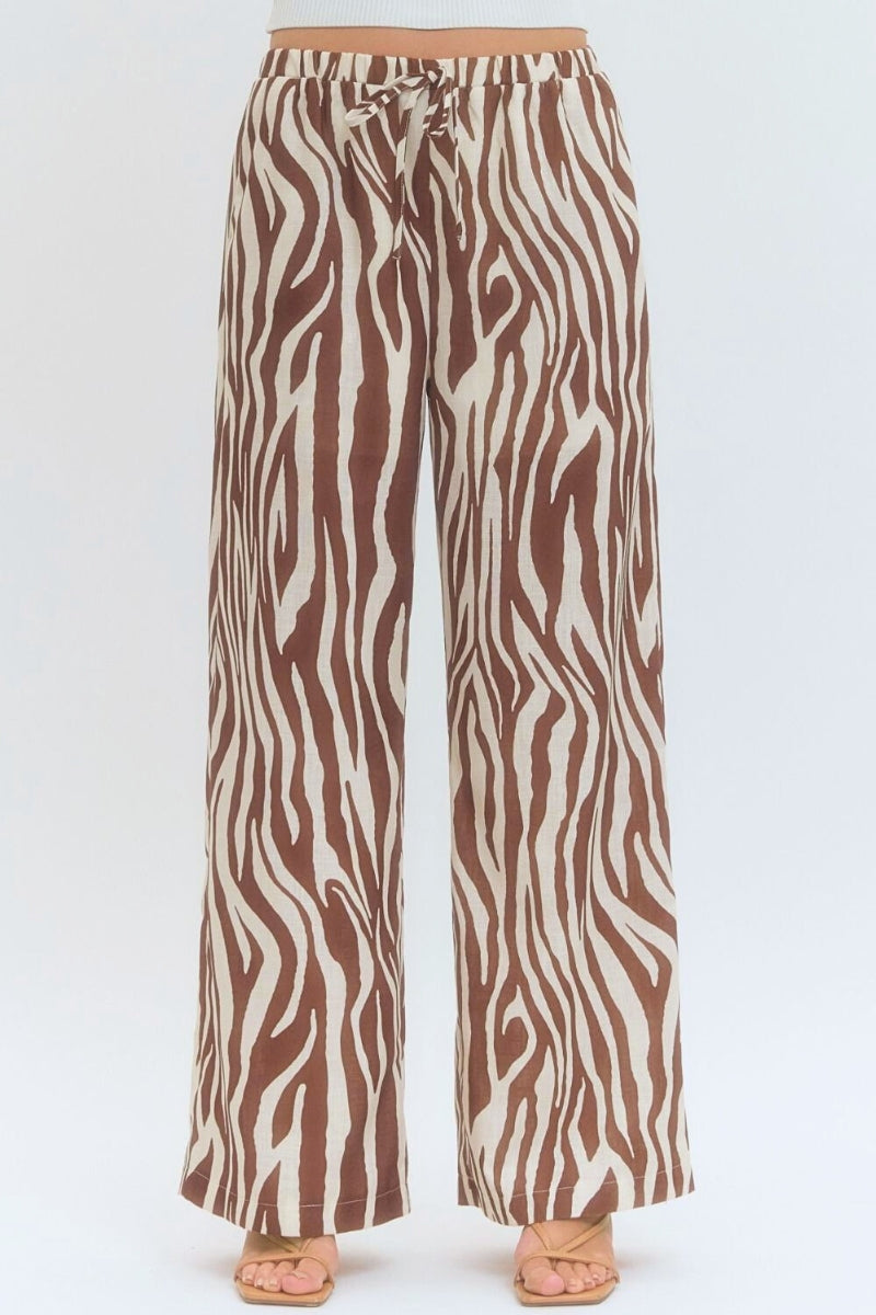 Zebra patterned pants on a white background
