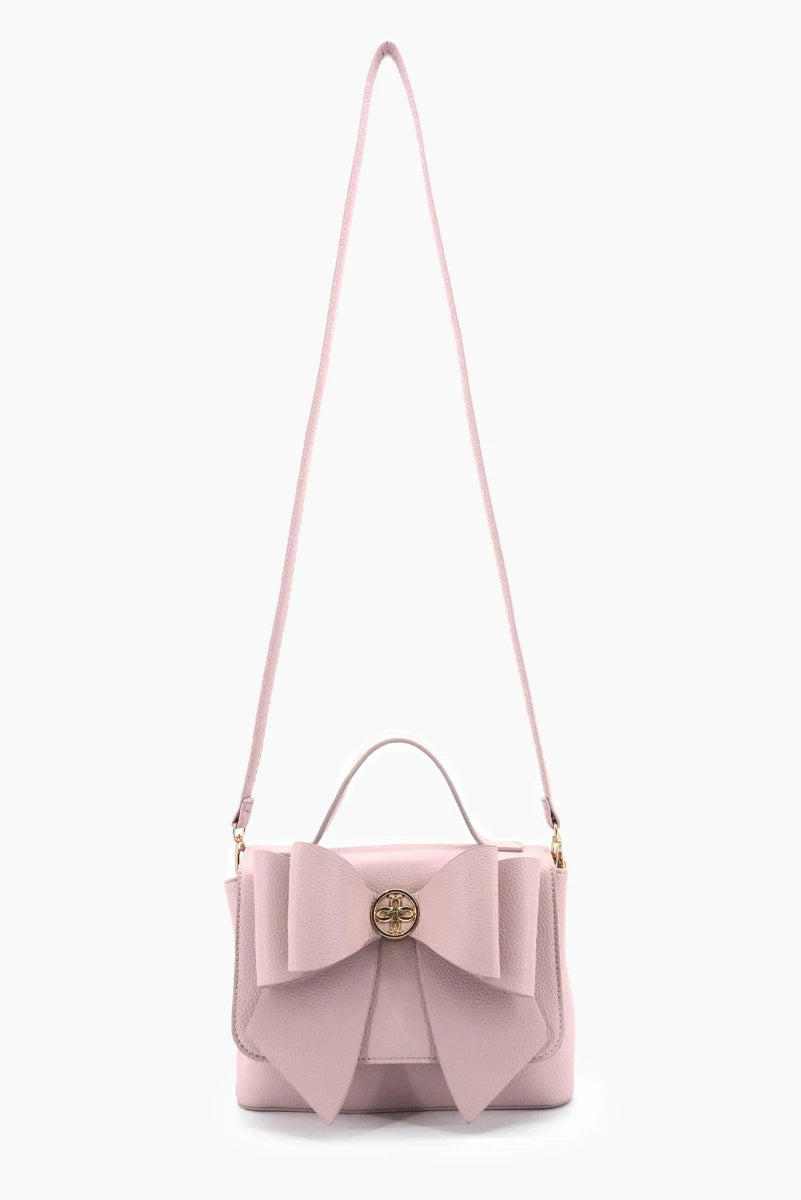 Pink handbag with a bow detail on a white background