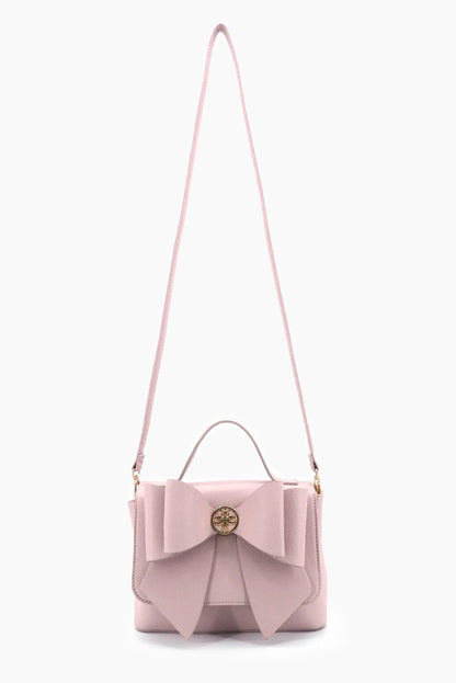 Pink handbag with a bow detail on a white background