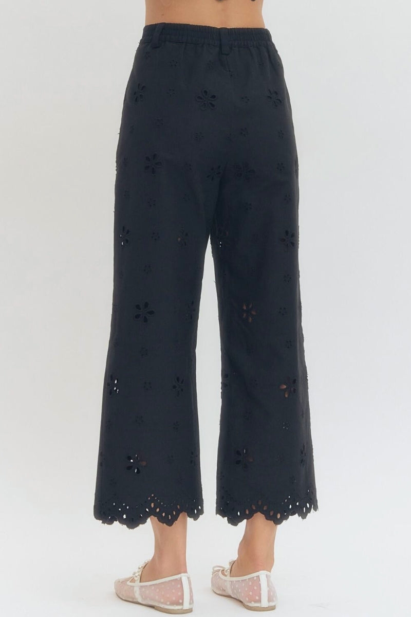 Black lace pants on a white background