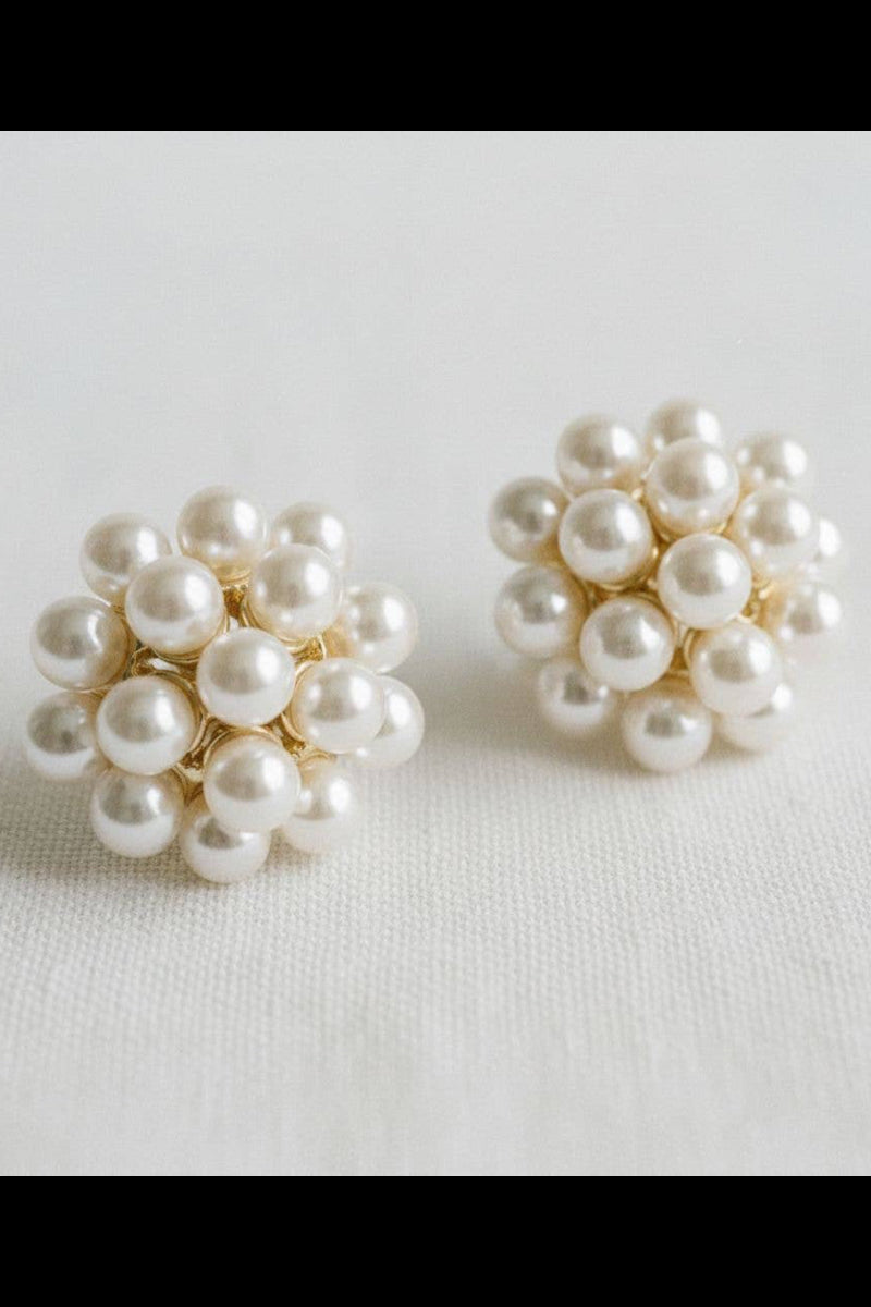 Pair of pearl earrings on a light background