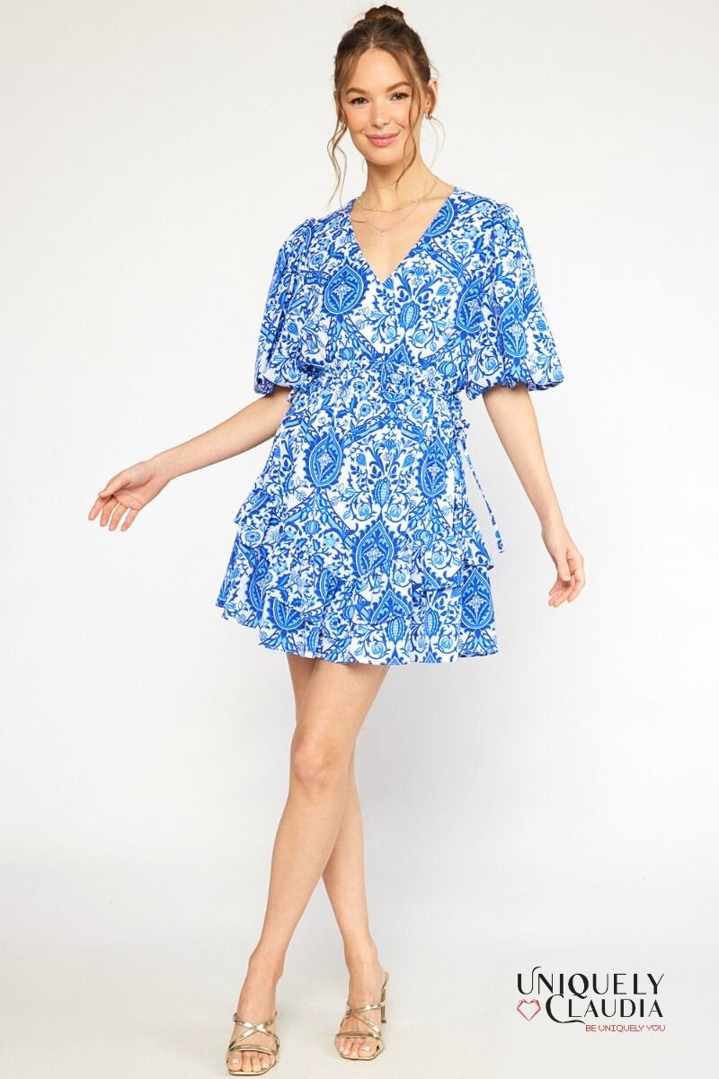 woman wearing blue puff sleeve dress