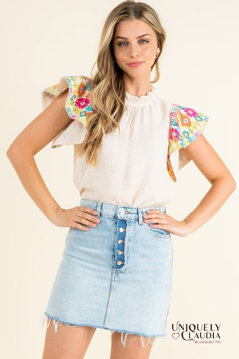 woman wearing top with colorful ruffle sleeves