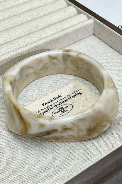 Marbled stone ring in a jewelry box with a card inside