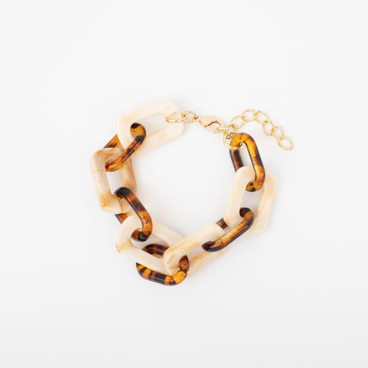 Bracelet with tortoiseshell and cream links on a white background