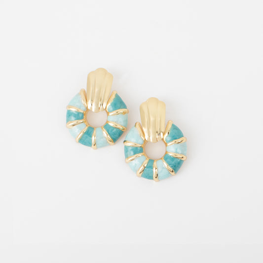 Pair of earrings with turquoise and gold design on a white background