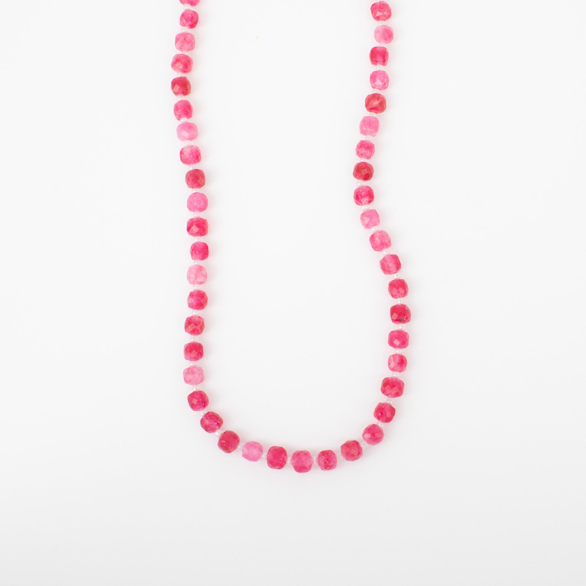 Necklace with pink beads on a white background
