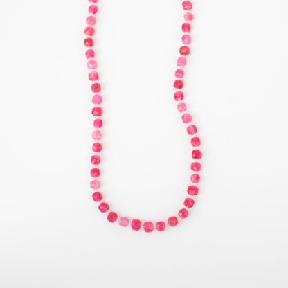 Necklace with pink beads on a white background