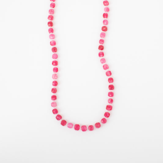Necklace with pink beads on a white background