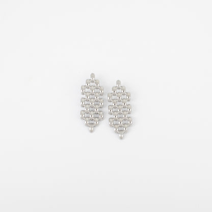 Pair of silver earrings on a light gray background