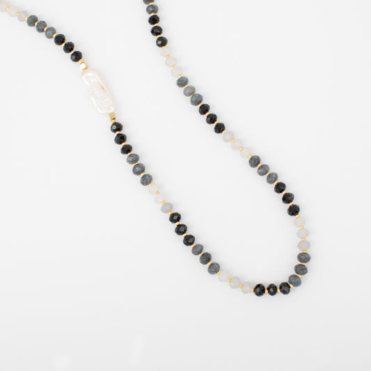 Necklace with black and gray beads on a white background