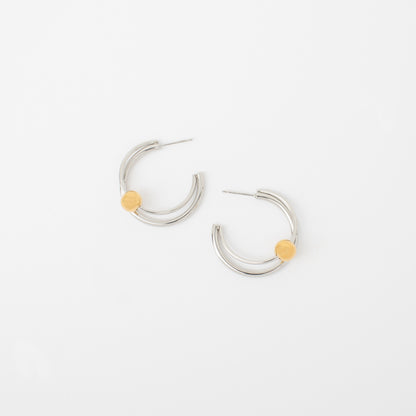 Silver hoop earrings with yellow accents on a white background