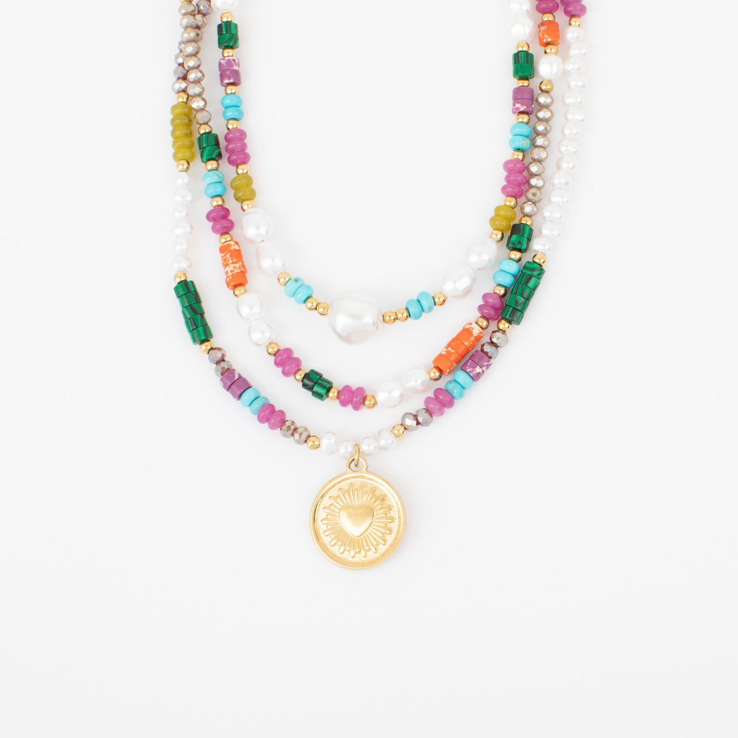 Multicolored beaded necklace with a gold pendant on a white background