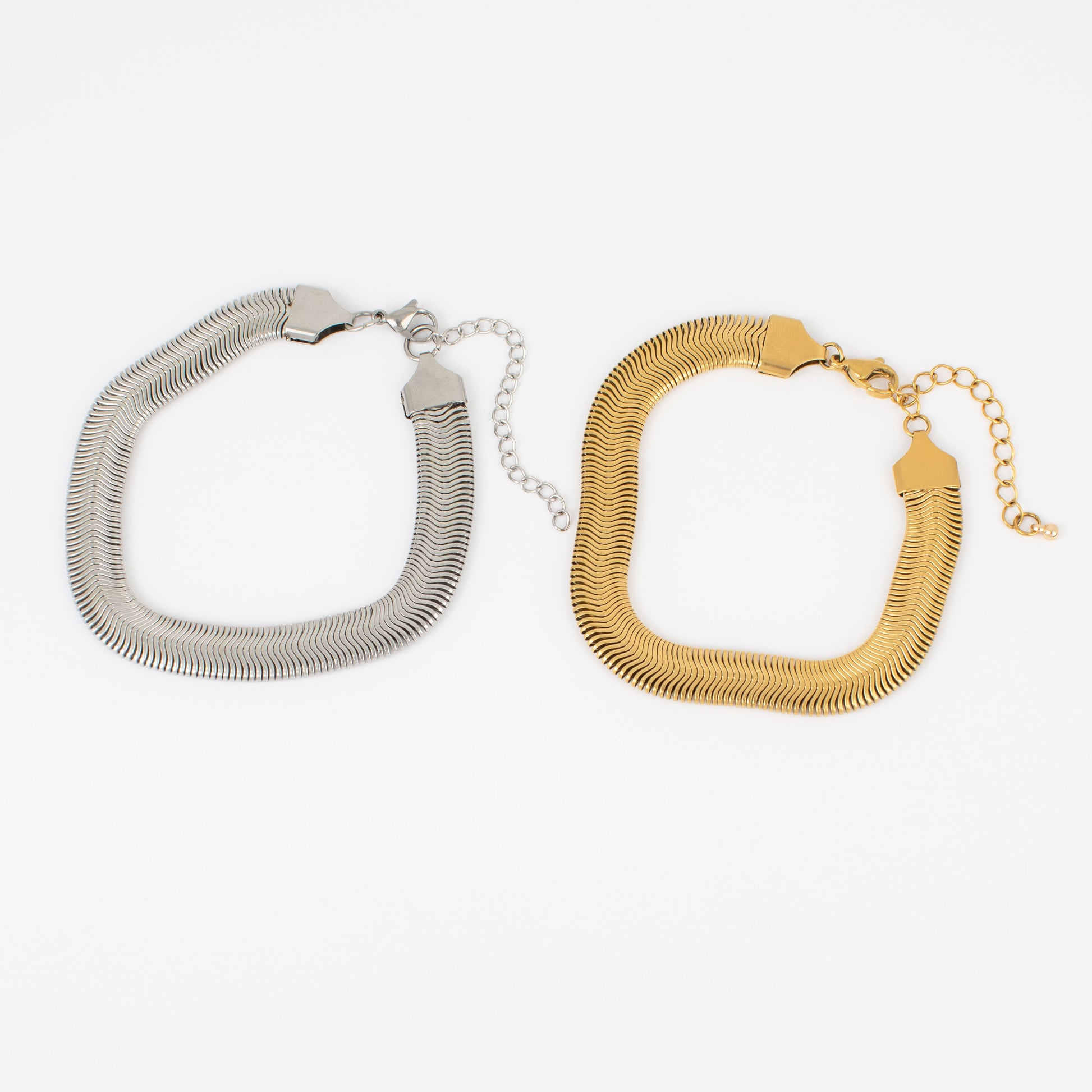 Gold and silver bracelets on a white background
