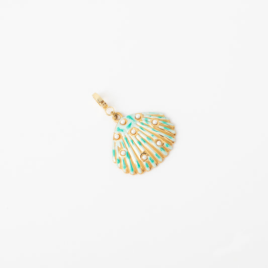 Gold and turquoise shell-shaped pendant on a white background