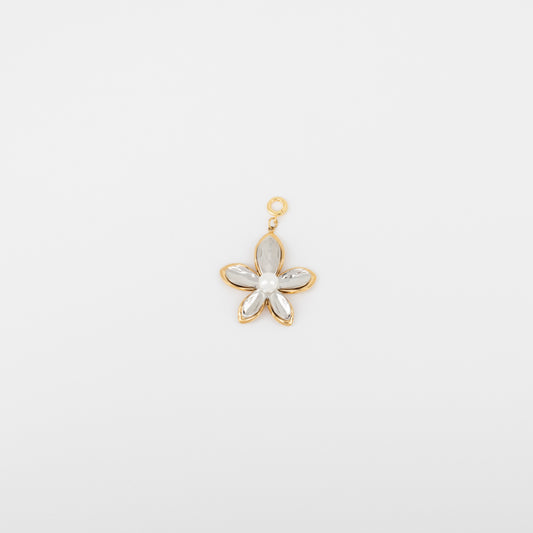 Gold flower-shaped pendant with a central pearl on a light gray background