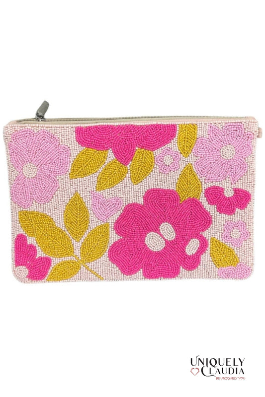 Floral beaded pouch with pink and yellow flowers on a white background, branded 'Uniquely Claudia'.