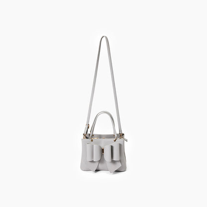 Light gray handbag with a bow detail on a white background