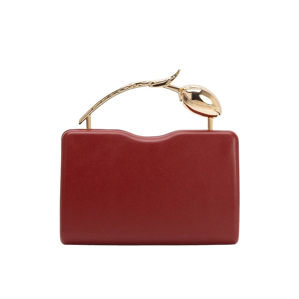 Red handbag with gold handle on a white background
