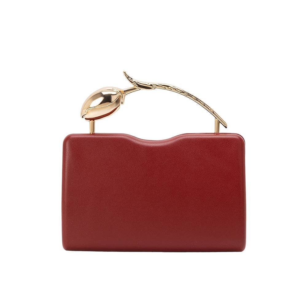 Red handbag with gold handle on a white background