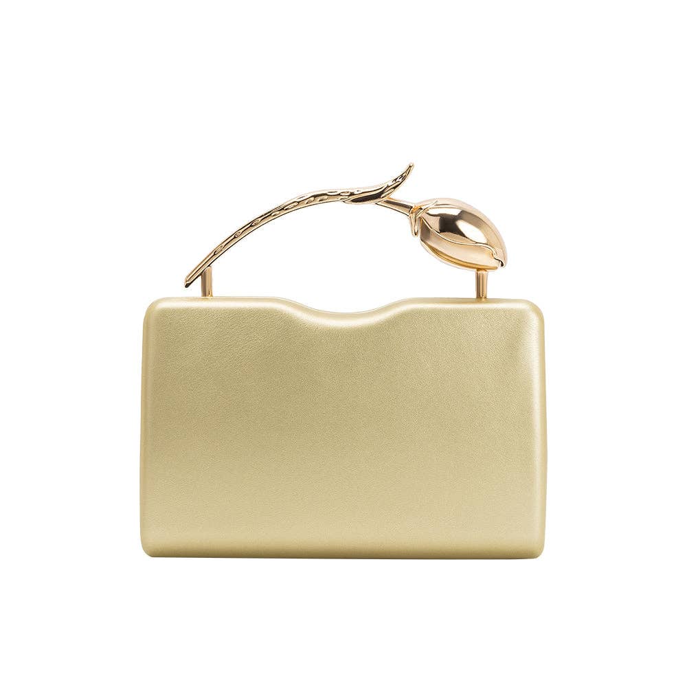 Gold clutch bag with a decorative handle on a white background