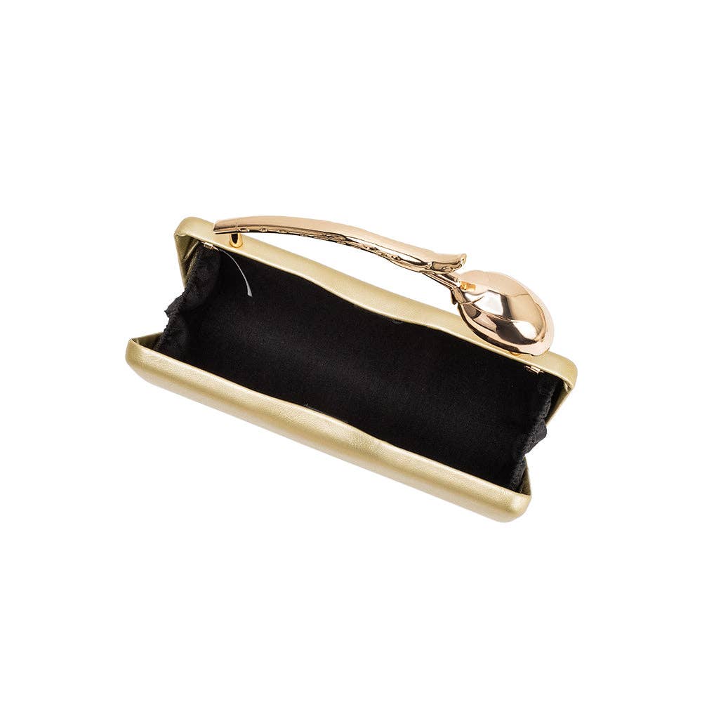 Gold clutch purse with black interior on a white background