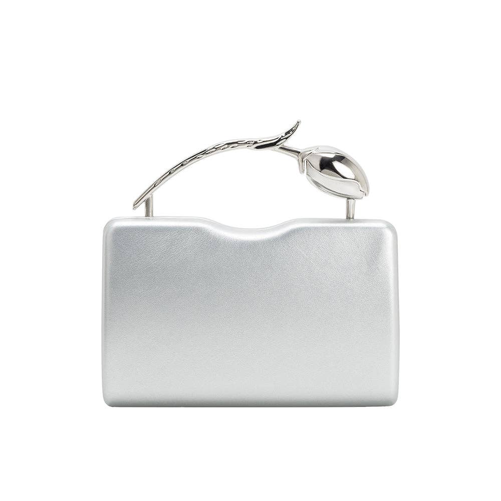 A silver metallic clutch bag with a wavy top edge and a decorative metallic handle shaped like a stylized leaf or branch, shown on a plain white background.
