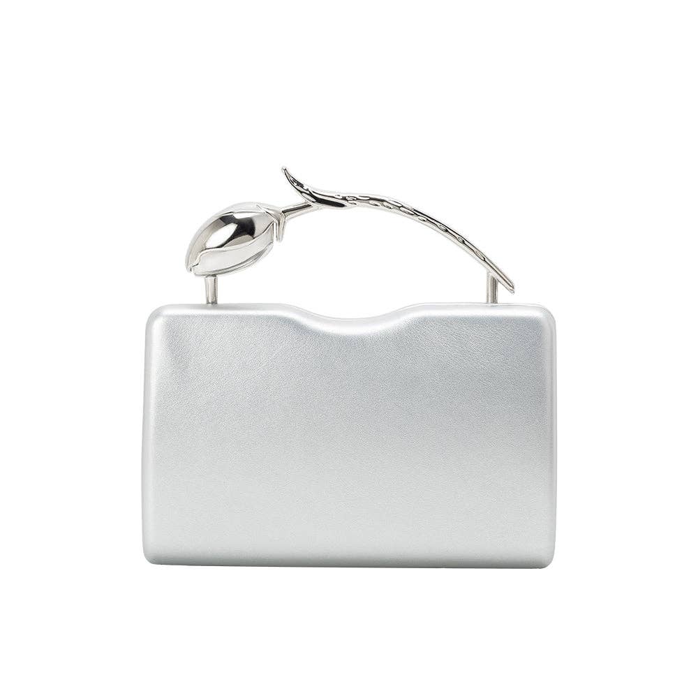 Silver clutch bag with a decorative handle on a white background
