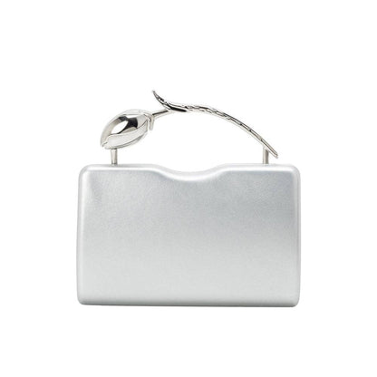 Silver clutch bag with a decorative handle on a white background