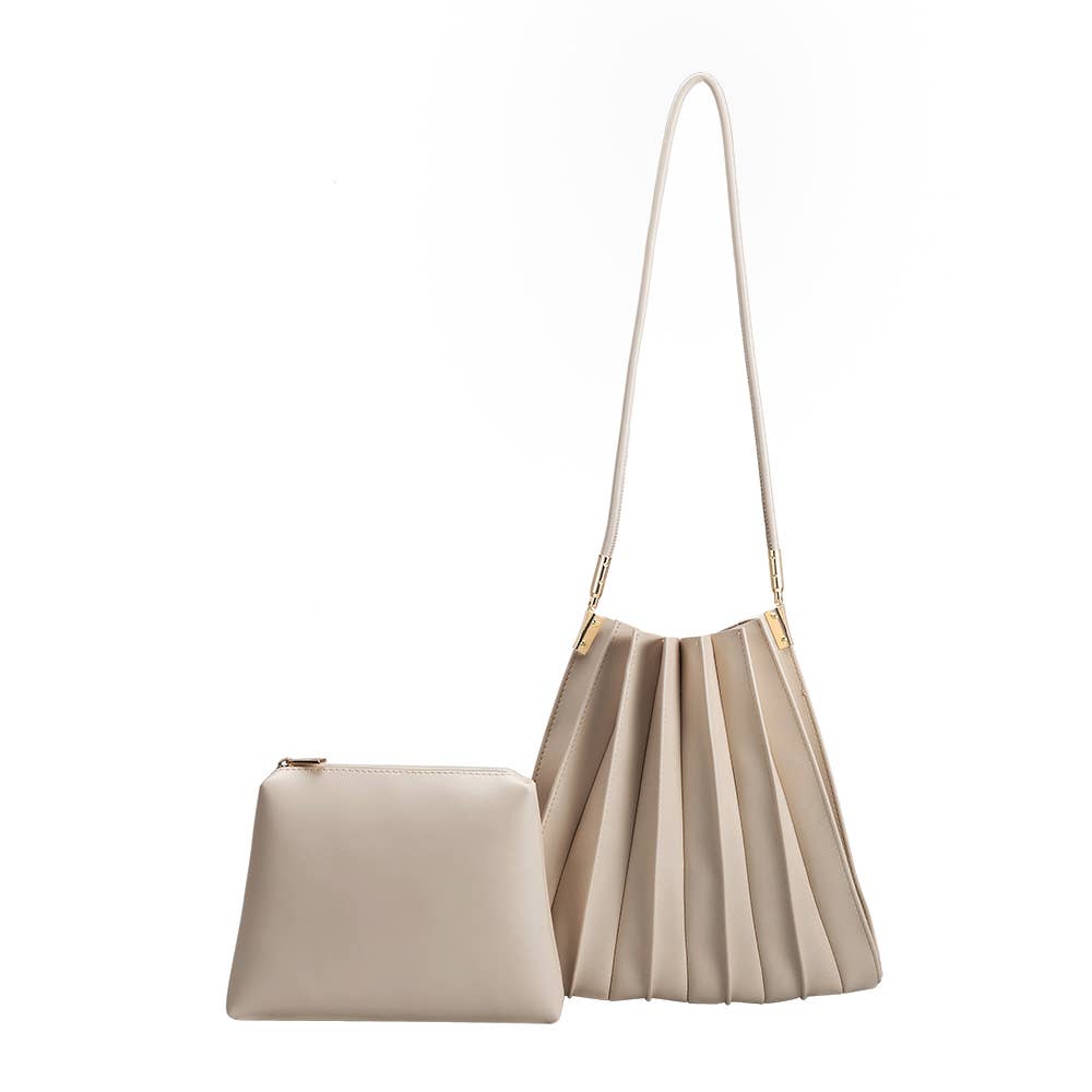 Beige handbag with pleated design on a white background