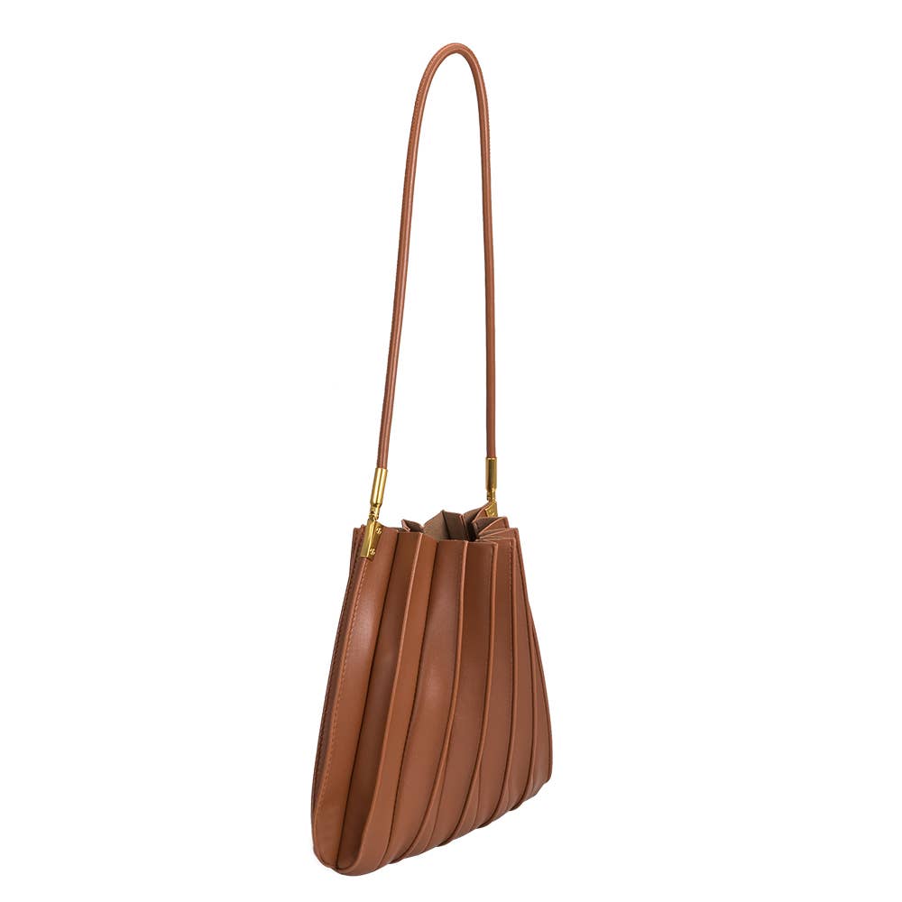 Brown leather handbag with a long handle on a white background
