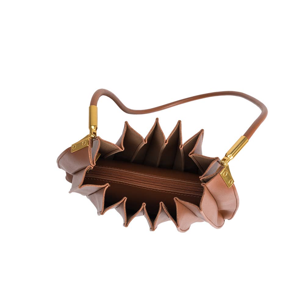 Brown handbag with unique design on a white background