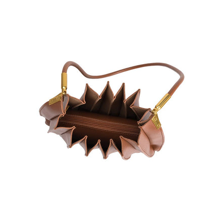 Brown handbag with unique design on a white background