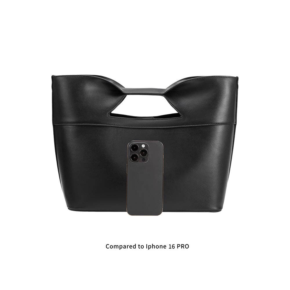 Black handbag with a phone case attached on a white background