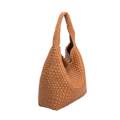 Saddle woven handbag on a white background