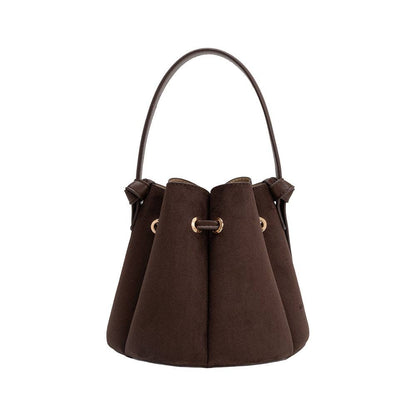 Brown handbag with gold accents on a white background