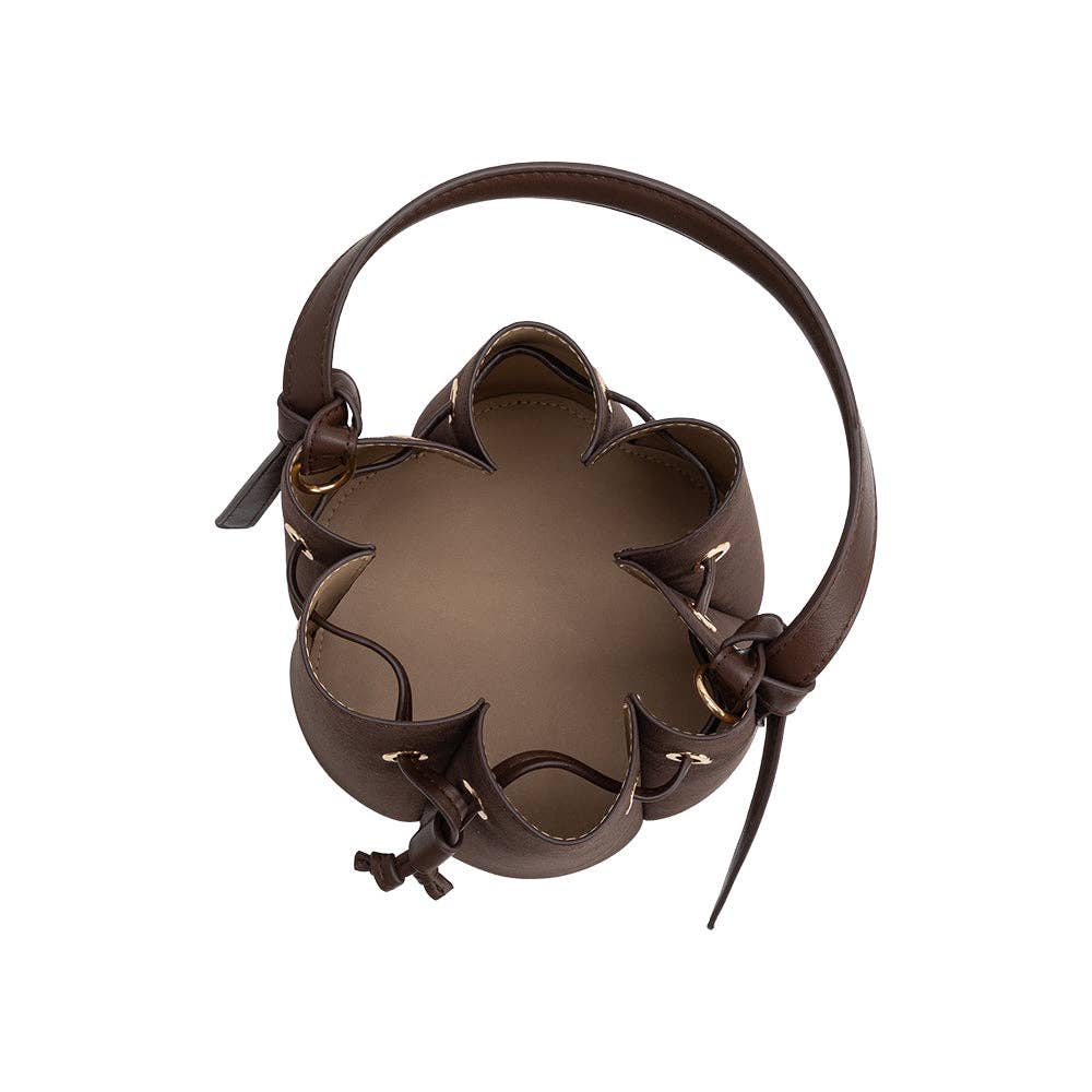 Brown leather headband with decorative elements on a white background