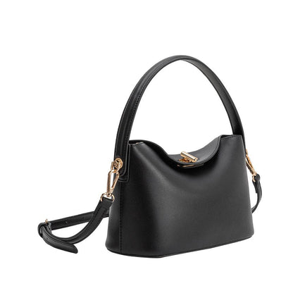 Black handbag with gold accents on a white background