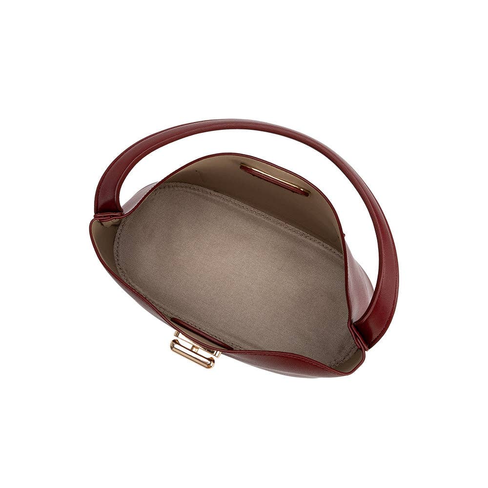 A top-down view of a burgundy leather handbag with a curved handle and gold-tone hardware, showing a gray interior lining, set against a plain white background.