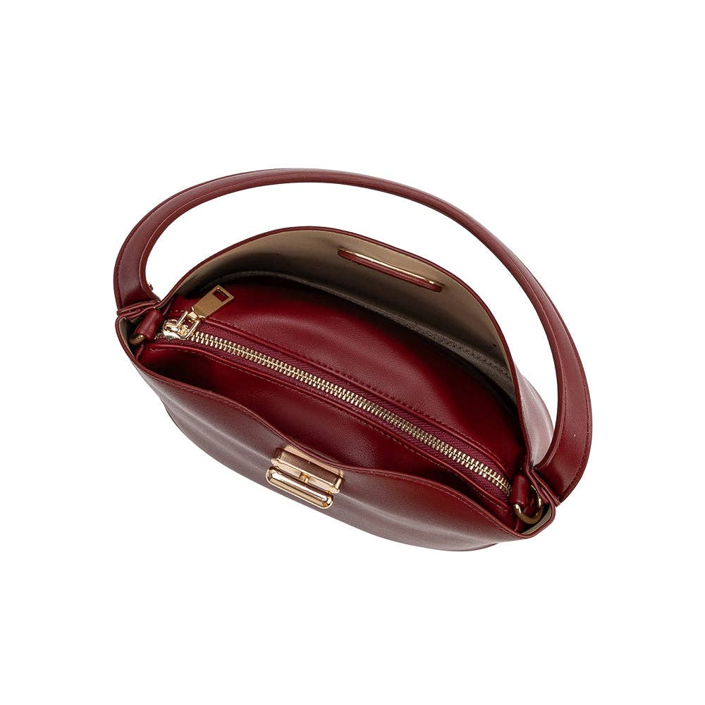 Burgundy handbag with gold zipper on a white background