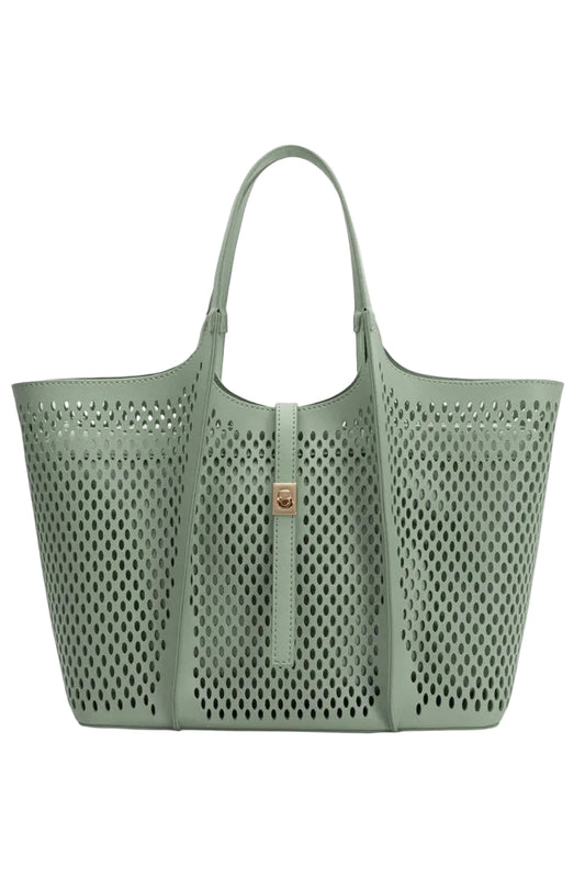 Mint green perforated handbag on a white background